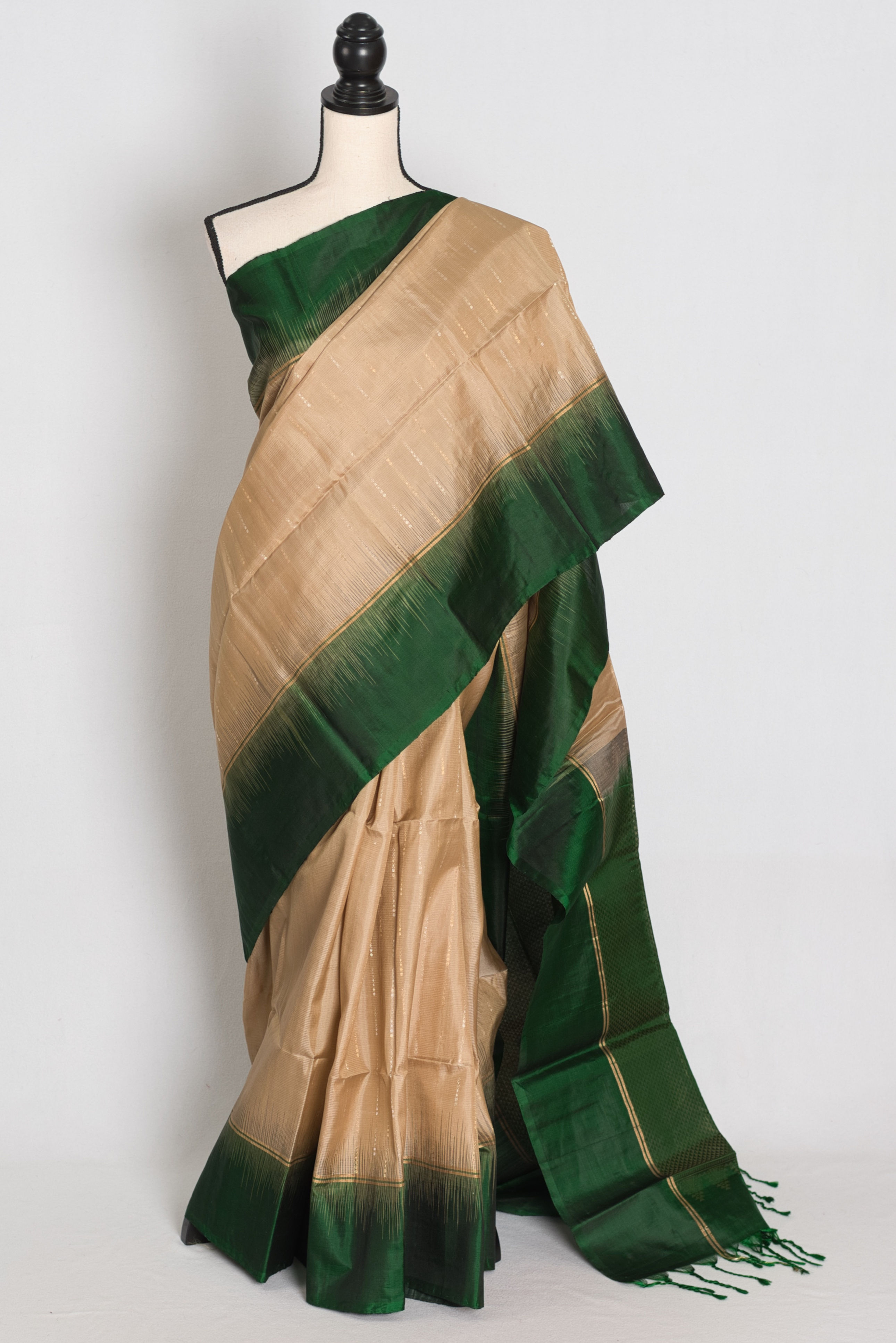 Clay brown lightweight Kanjivaram silk saree with pinstripes, solid plain bottle green border, textured green pallu.