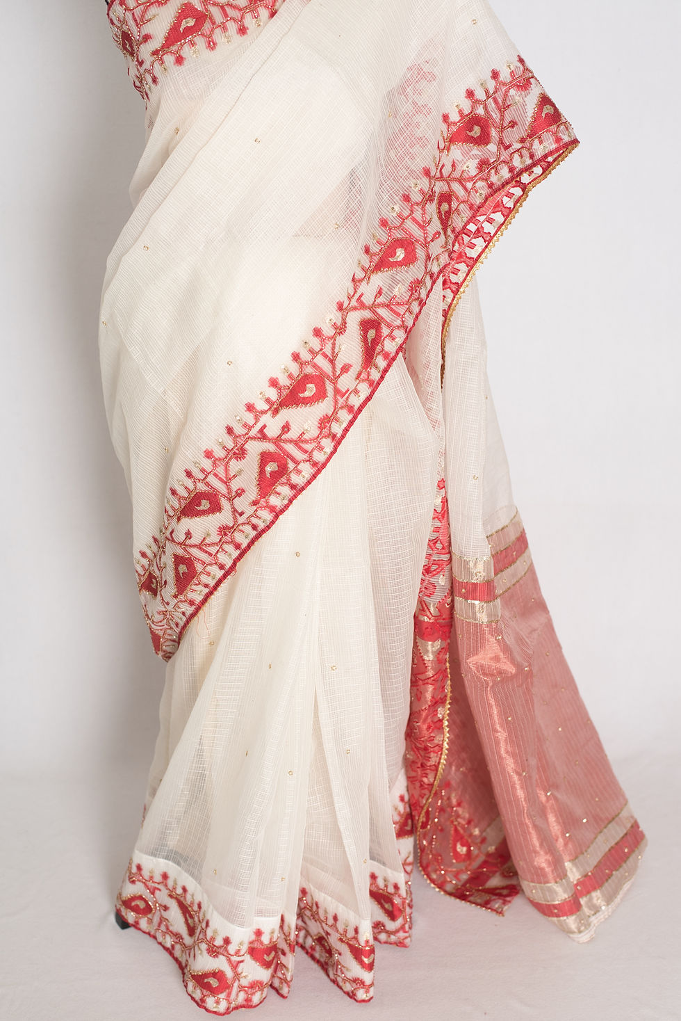 Thumbnail: full length front view of white and red blended Kota silk Jamdani saree with hand embroidery cut dana work on a mannequin.