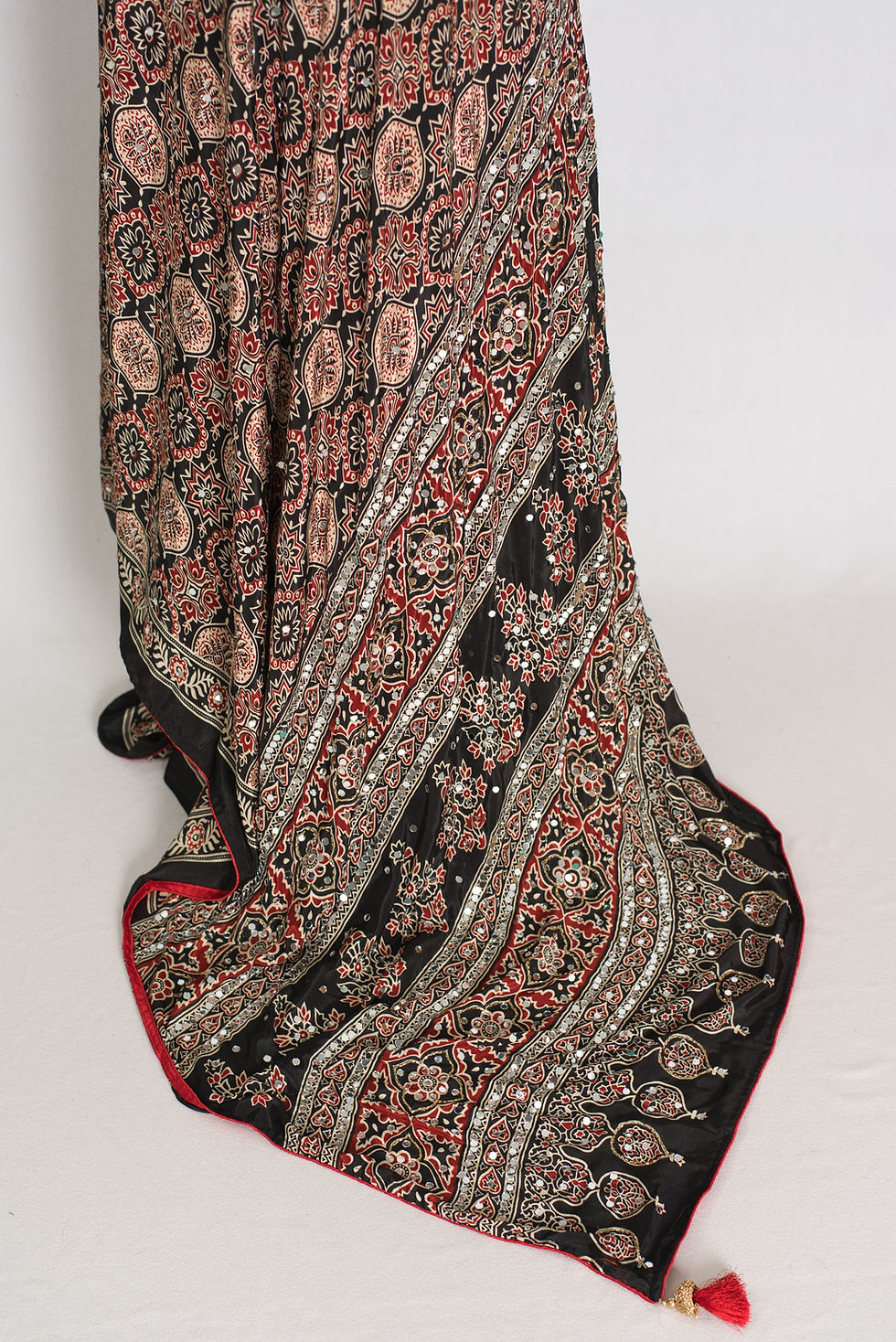Thumbnail: Black semi modal silk partywear saree draped on a mannequin, showcasing mirror work.