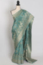 Grey-green semi crepe silk Banarasi saree with silver or gold zari floral patterns (Harini Collection).
