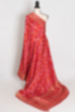 Front full-length view of the red Gharchola Dola silk Banarasi saree draped on a mannequin.