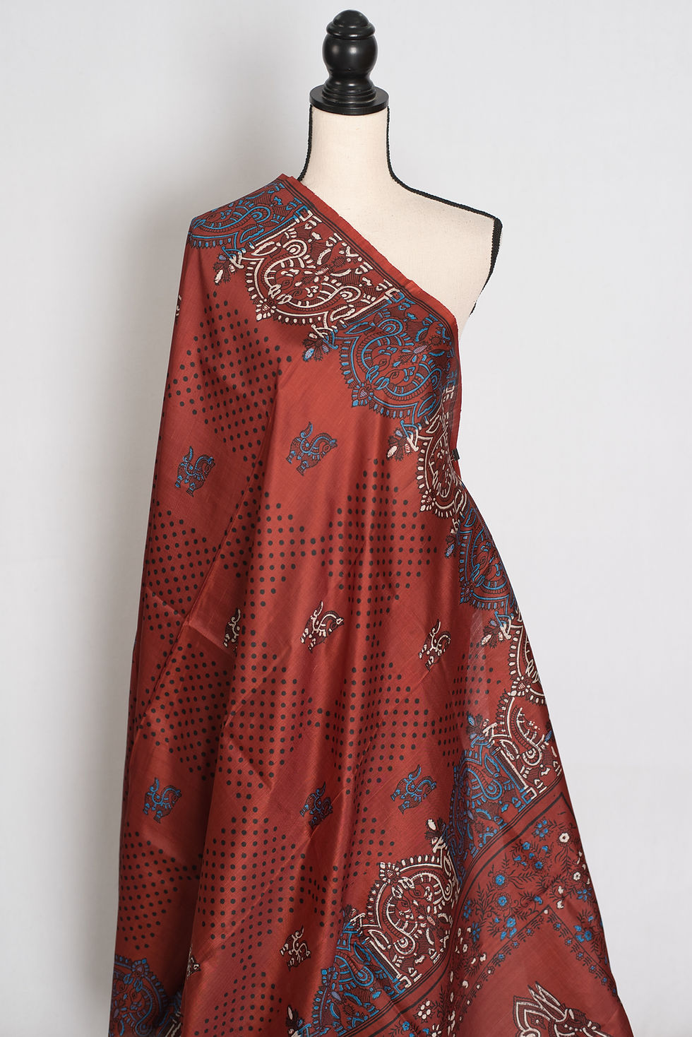 Thumbnail: Brown Bishnupuri silk saree with hand block printed geometric borders and folk motifs draped on a mannequin.