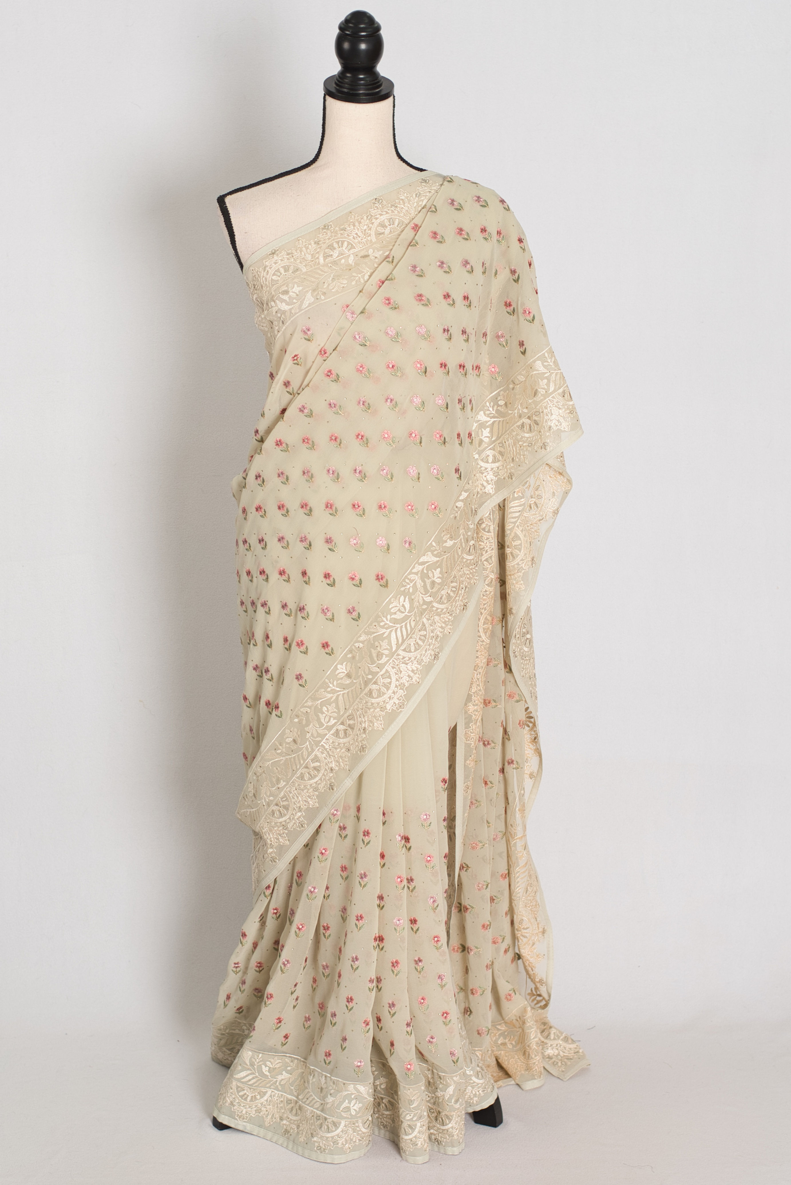 Full view of Light Sage Green Georgette Partywear Saree draped on a mannequin..