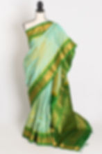 Mitra dual-tone green handwoven Gadwal silk saree with contrast green zari border.