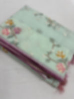 Sea green blended cotton kota saree with floral embroidery, self checks pattern, and pink piping border.