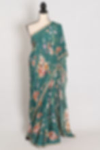 Full-length view of the Afrin teal floral Chinon crepe saree on a mannequin, showcasing the soft drape and pearl border.