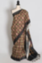Black and gold contemporary banarasi katan silk saree featuring geometric ikkat print on a full mannequin drape.