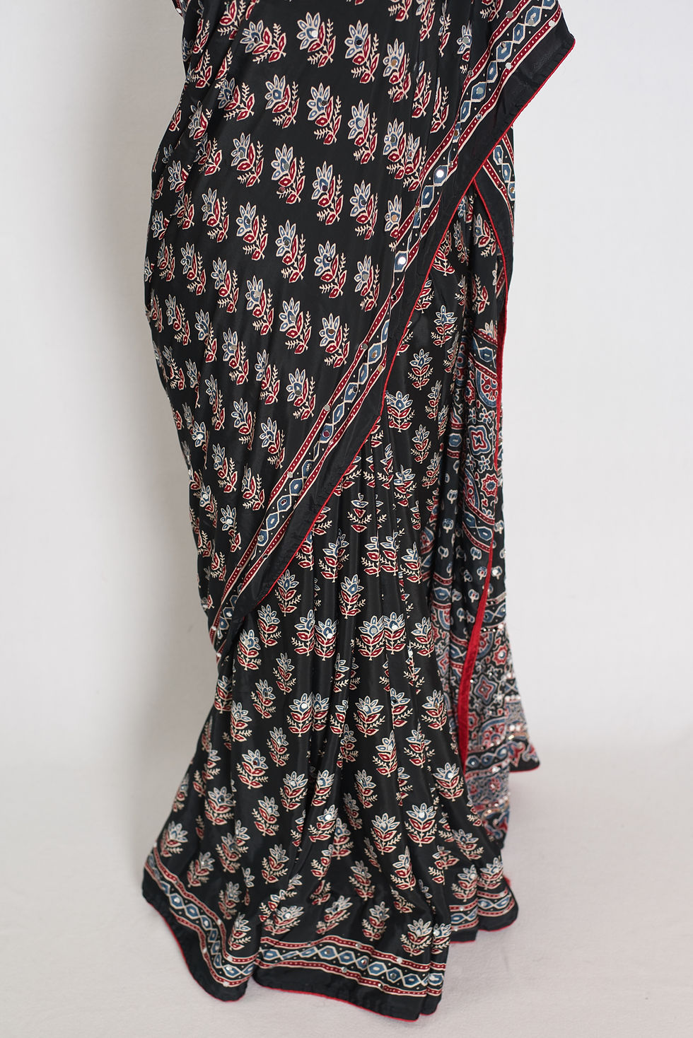 Thumbnail: Black semi modal silk partywear saree draped on a mannequin, showcasing mirror work.