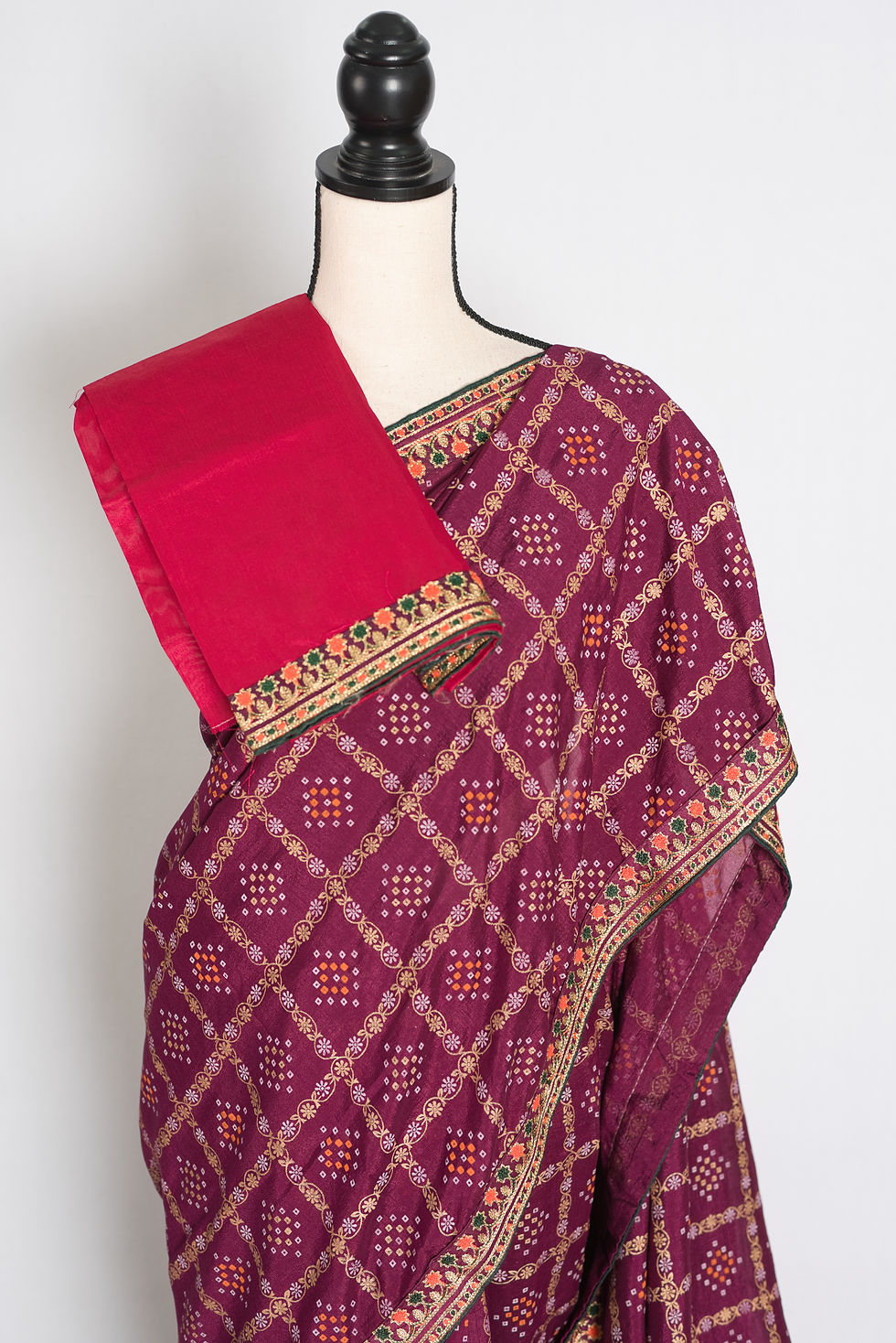 Thumbnail: Purple Gharchola gold printed saree with stitched embroidery border draped on a mannequin, showcasing the full length.