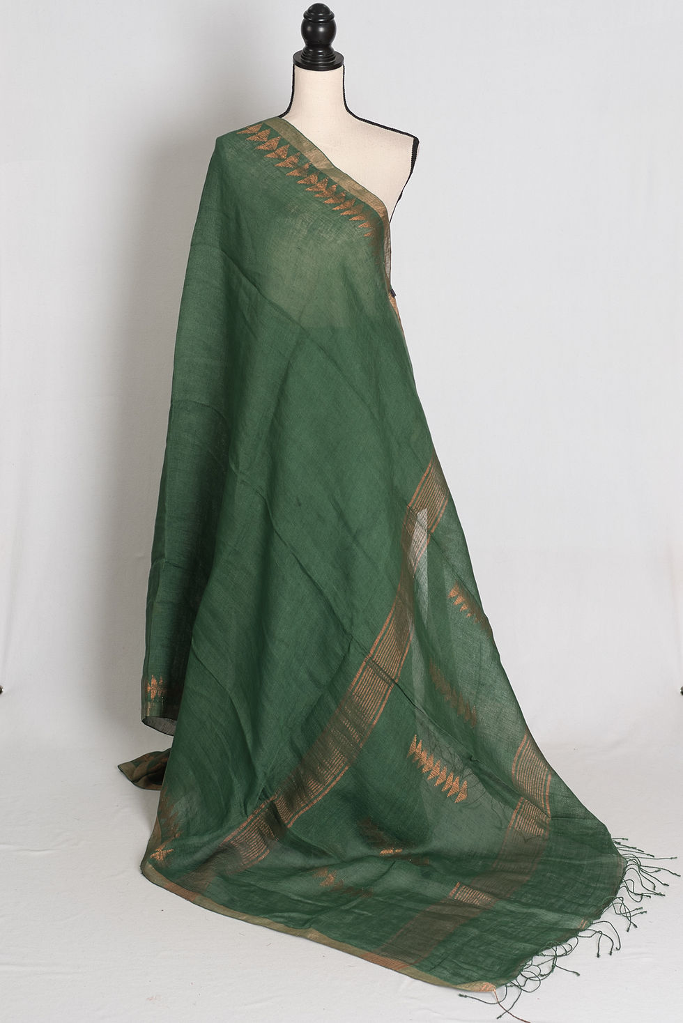 Forest green and gold 80 count handwoven Bengali linen Jamdani saree featuring triangular gold needlework borders.