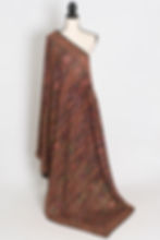 Black georgette partywear saree beautifully draped on a mannequin, showcasing Kashmiri machine embroidery jaal.