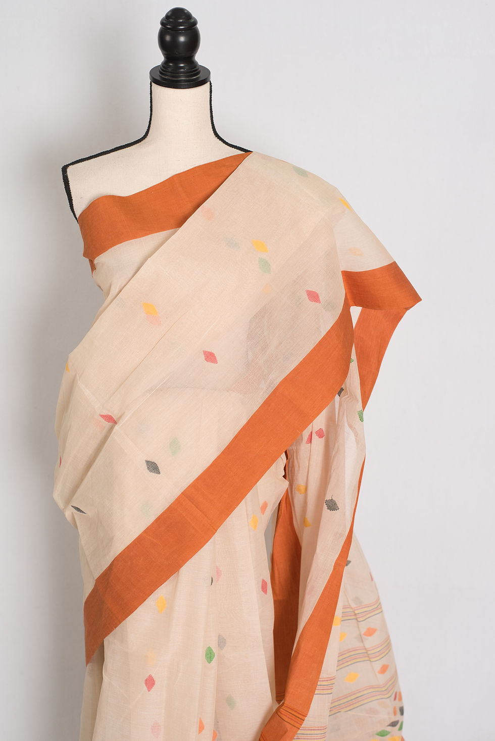 Thumbnail: Front view of Light Brown Pure Cotton Bengal Handloom Jamdani Saree with terracotta border on a mannequin.