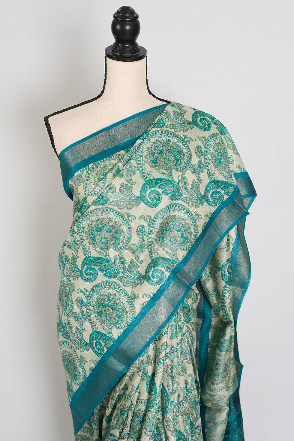 Thumbnail: Vidhi block printed Muga Tussar silk saree in off-white and turquoise blue with paisley motifs.