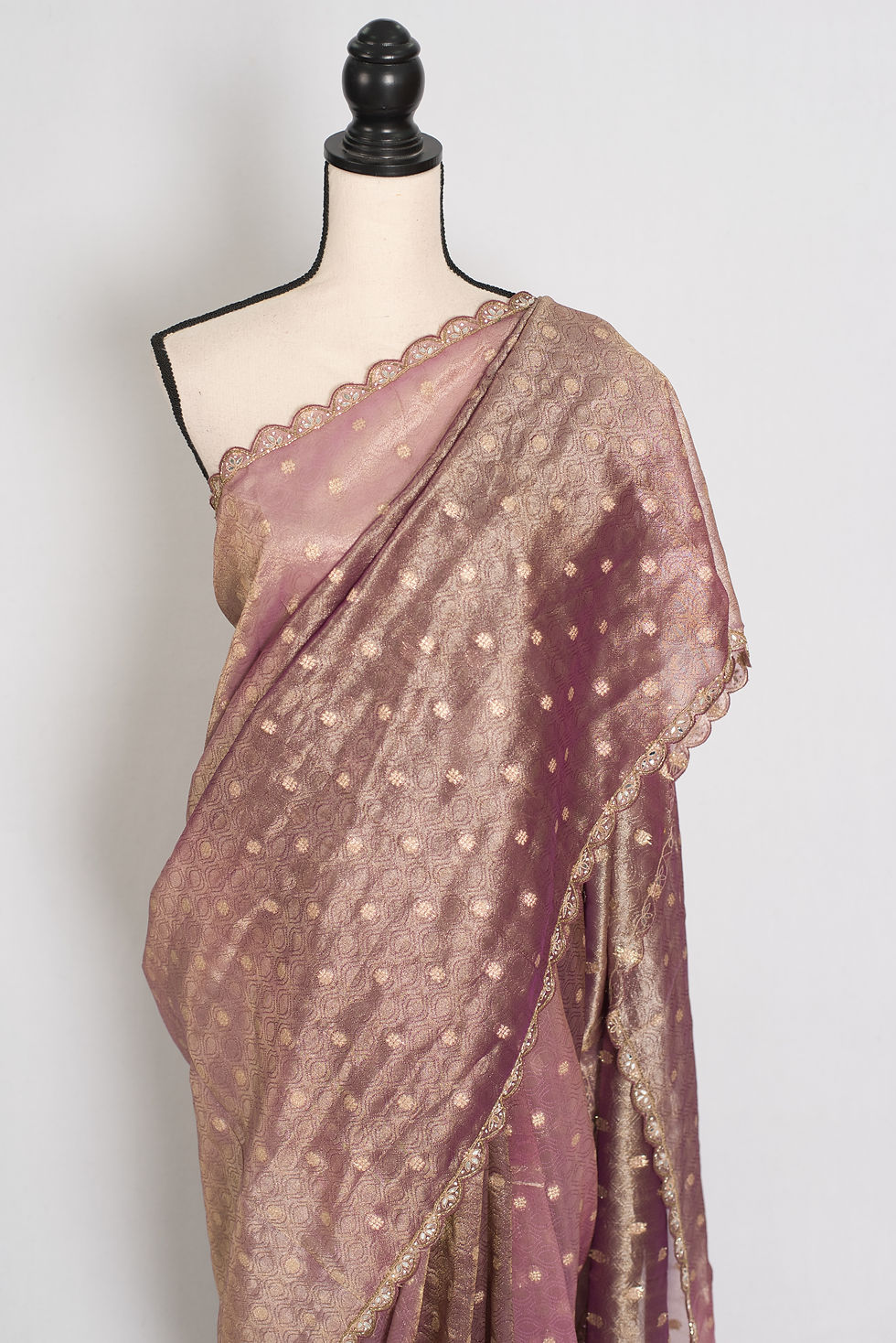 Thumbnail: Shobha mauve soft tissue partywear saree featuring intricate gold Zardosi hand embroidery and a contemporary metallic sheen.