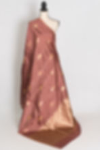 SIA: Chocolate brown Katan Banarasi silk saree with gold zari floral buttas and intricate border on a mannequin.