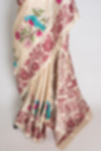 Thumbnail: Beige and maroon pure Gachi Tussar silk saree featuring hand-embroidered turquoise bird motifs and rich maroon floral borders