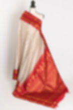 Mira white and brown micro-check Gadwal silk saree with a rich red and gold zari border.