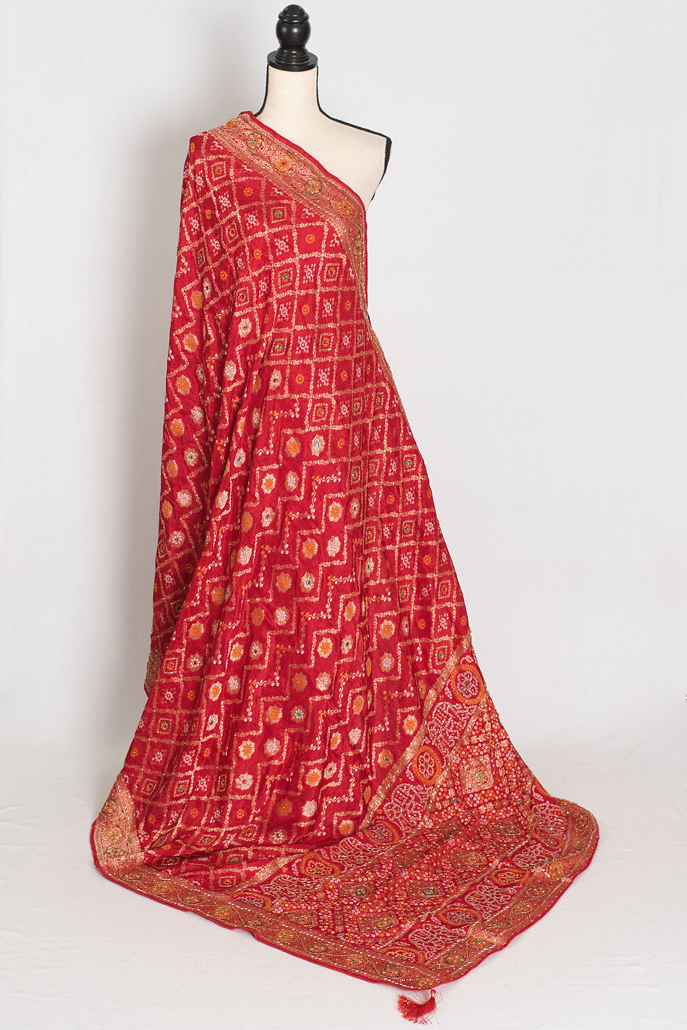 Thumbnail: Front full-length view of the red bridal Dola silk Banarasi saree draped on a mannequin.