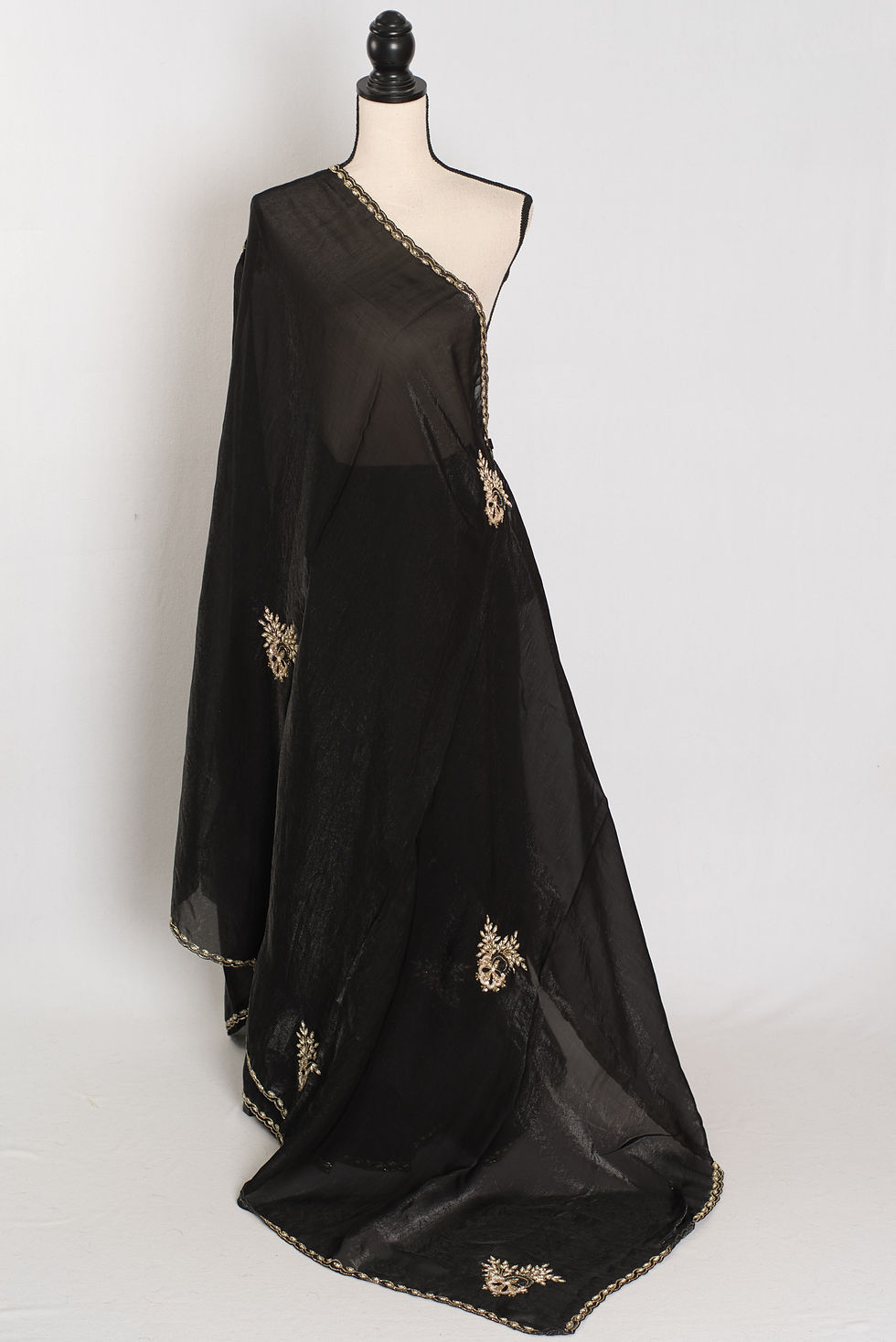 Kajal black and gold glass tissue saree with heavy hand-embroidered cut dana work.
