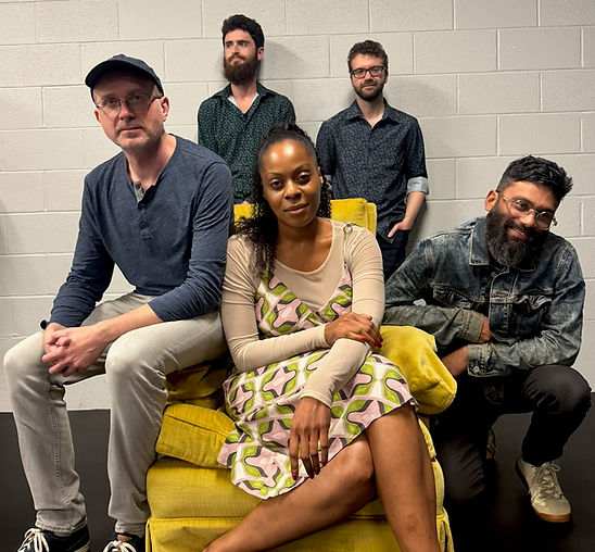 2025 Band photo with yellow chair (1).jpeg