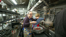 ost storm, volunteer Eve Scott-Ludwig is back at work at the Family Table Collaborative, helping to prepare a large pot of chili on March 3