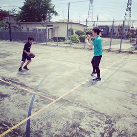 Students playing basketball in the summer heat