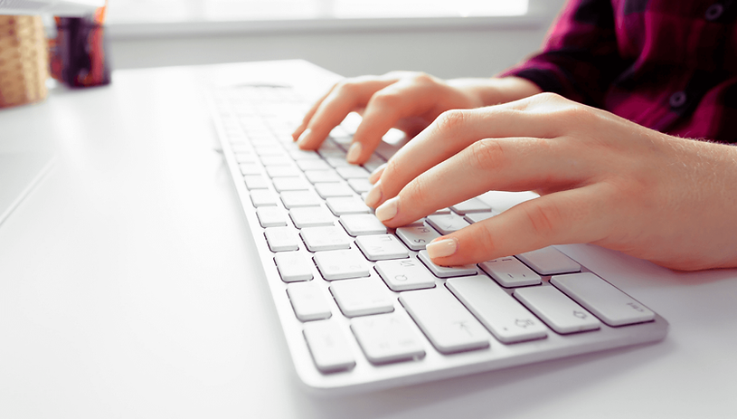 Medical AI platform project image – Close-up of hands typing on a white keyboard, representing a brand audit