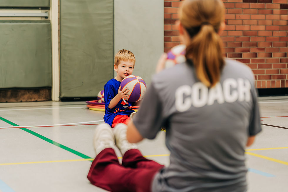 One of our HoopsterTots kids working on shooting form