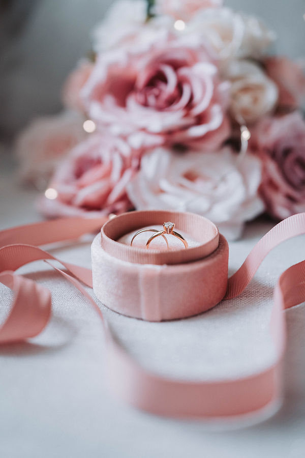 Engagement ring in a box with roses