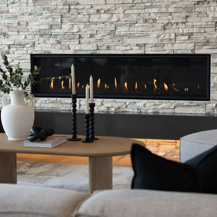 Modern fireplace and living room detail photographed for a luxury real estate listing.