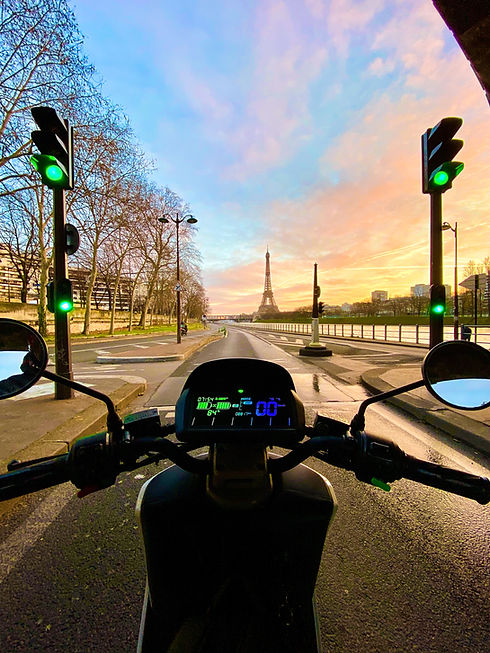 Niu electric scooter dashboard with Eiffel Tower ahead
