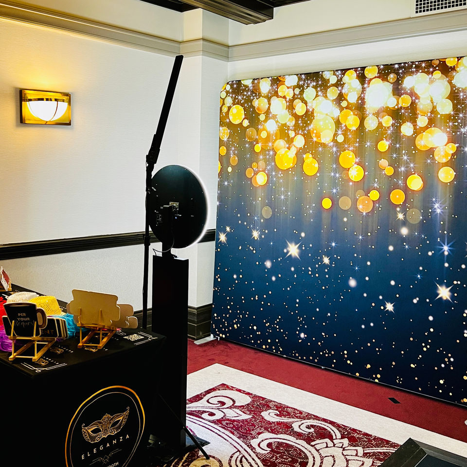 A team celebrating in a 360 events photo booth with dynamic video effects.