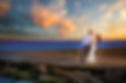 Romantic couple embracing at sunset beach
