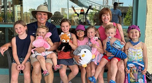 Gordon and his wife surrounded by his grandchildren
