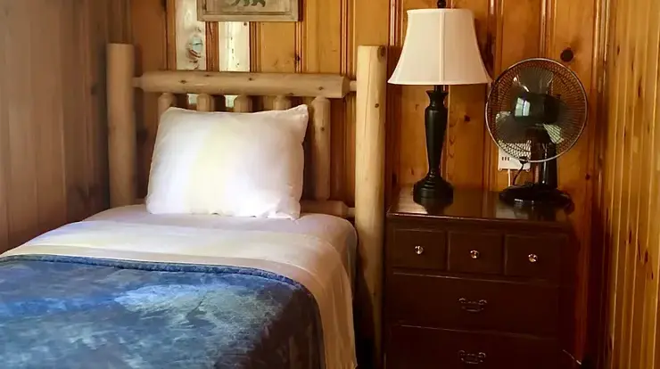 One of two Twin XL beds in Bear Cave's bedroom #3. Bedroom is configured as a tandem room. There is a door separating the two twin beds.