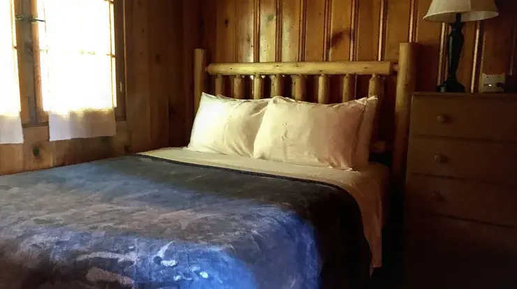 Bear Cave bedroom #2. This bedroom has a queen sized bed and a full sized dresser.