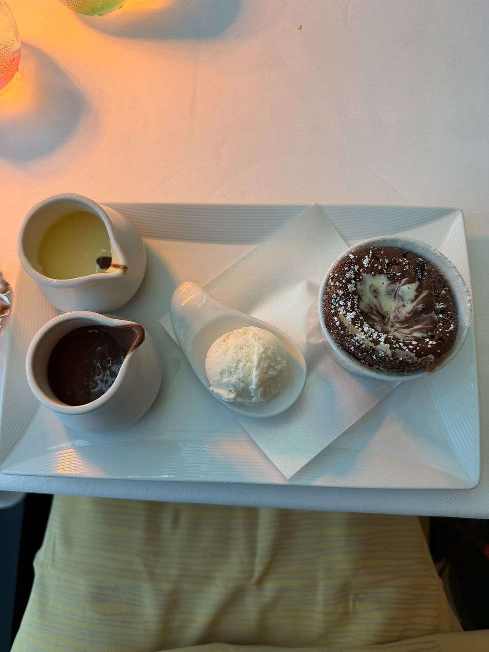 Palo chocolate soufflé with vanilla bean gelato and sauces