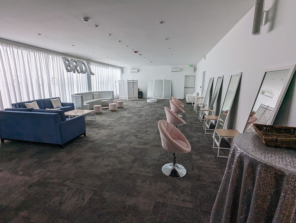 Large modern bridal suite with multiple salon stations and lounge seating