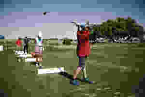 children playing golf at a golf course