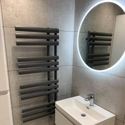 bathroom-and-plumbing-install-with-tiling-and-radiator-fitting-mirror