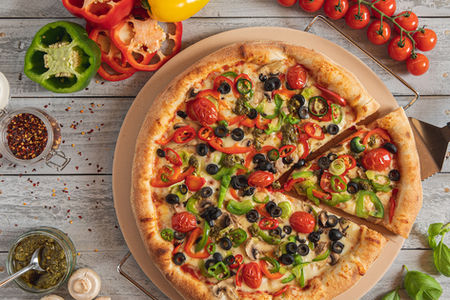 Vegetable pizza with slice, food photography