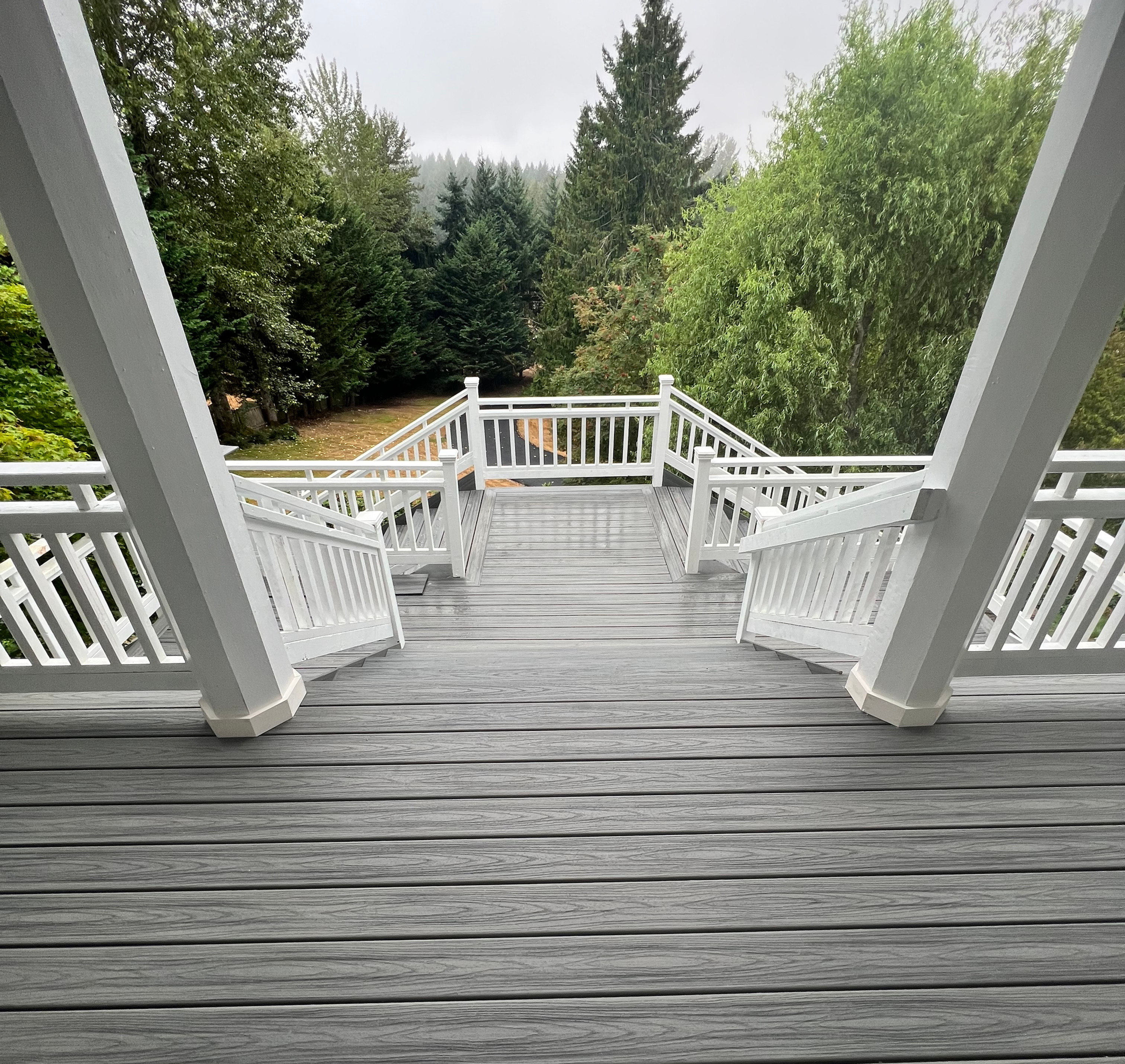 Custom 750-square-foot Trex composite deck in Puyallup built with structural framing and a secure under-deck dry storage room.