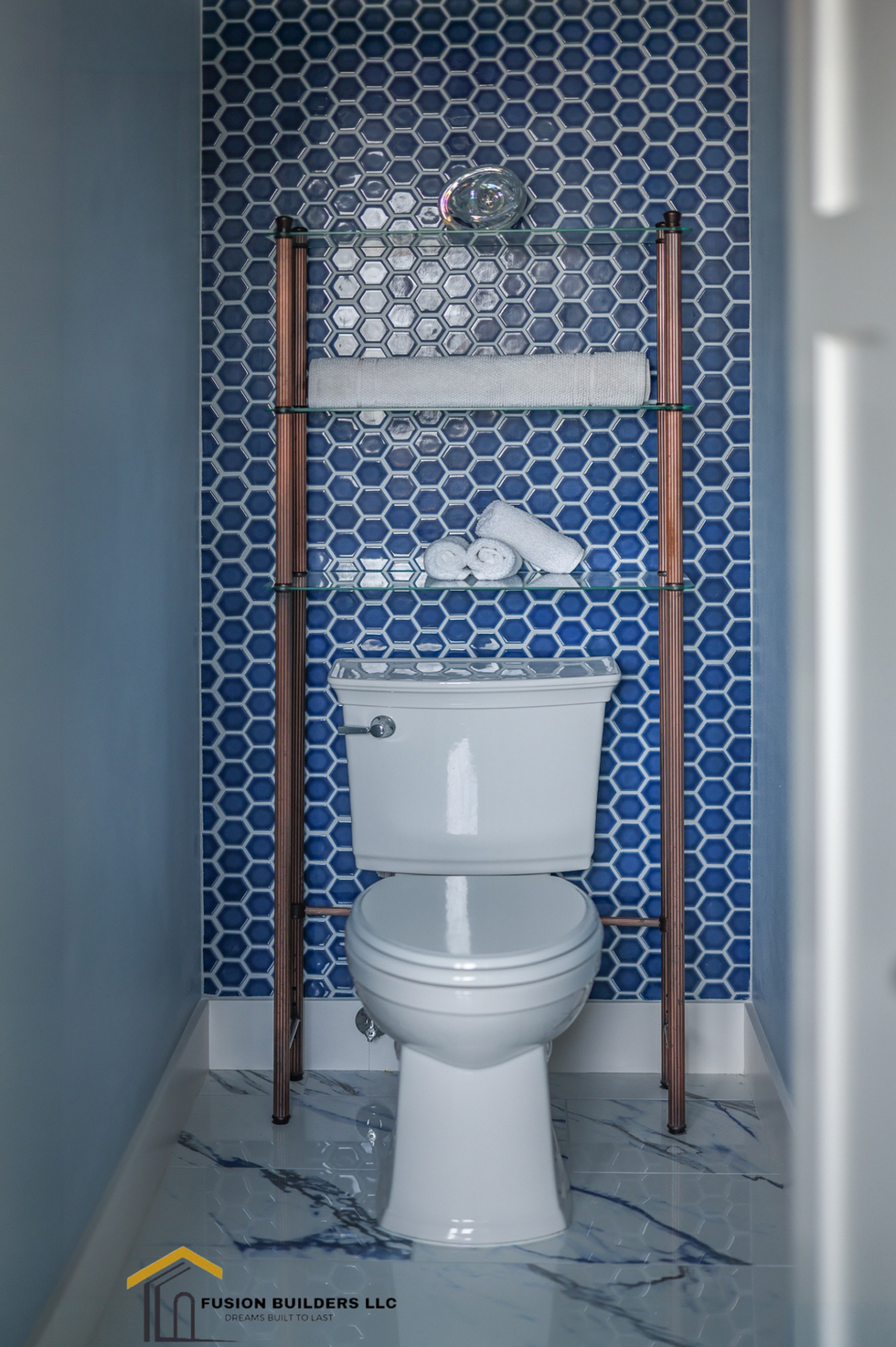 Modern private toilet room with high-end finishes in a Gig Harbor master bathroom.