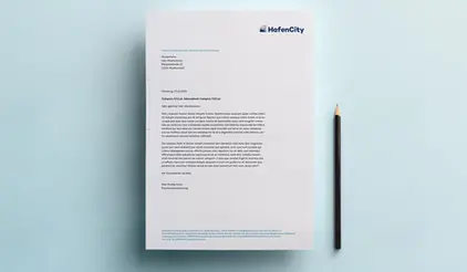 HafenCity letterhead document with printed text, lying next to a black pencil on a light blue background. 