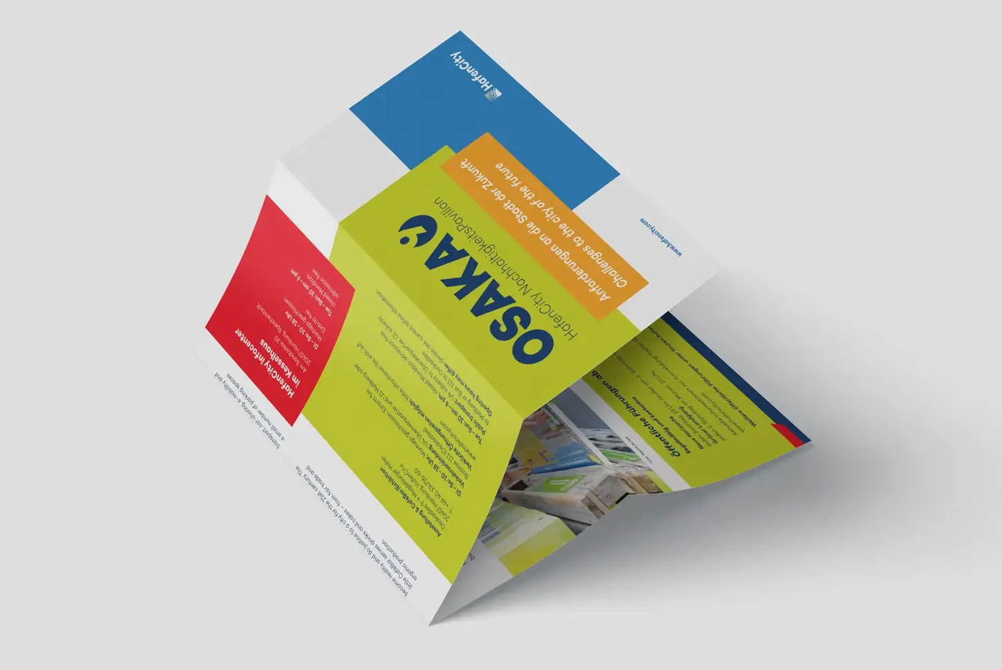 Folded flyer for 'OSAKA Nachhaltigkeitspavillon' with green, red, and blue panels displaying event details. 