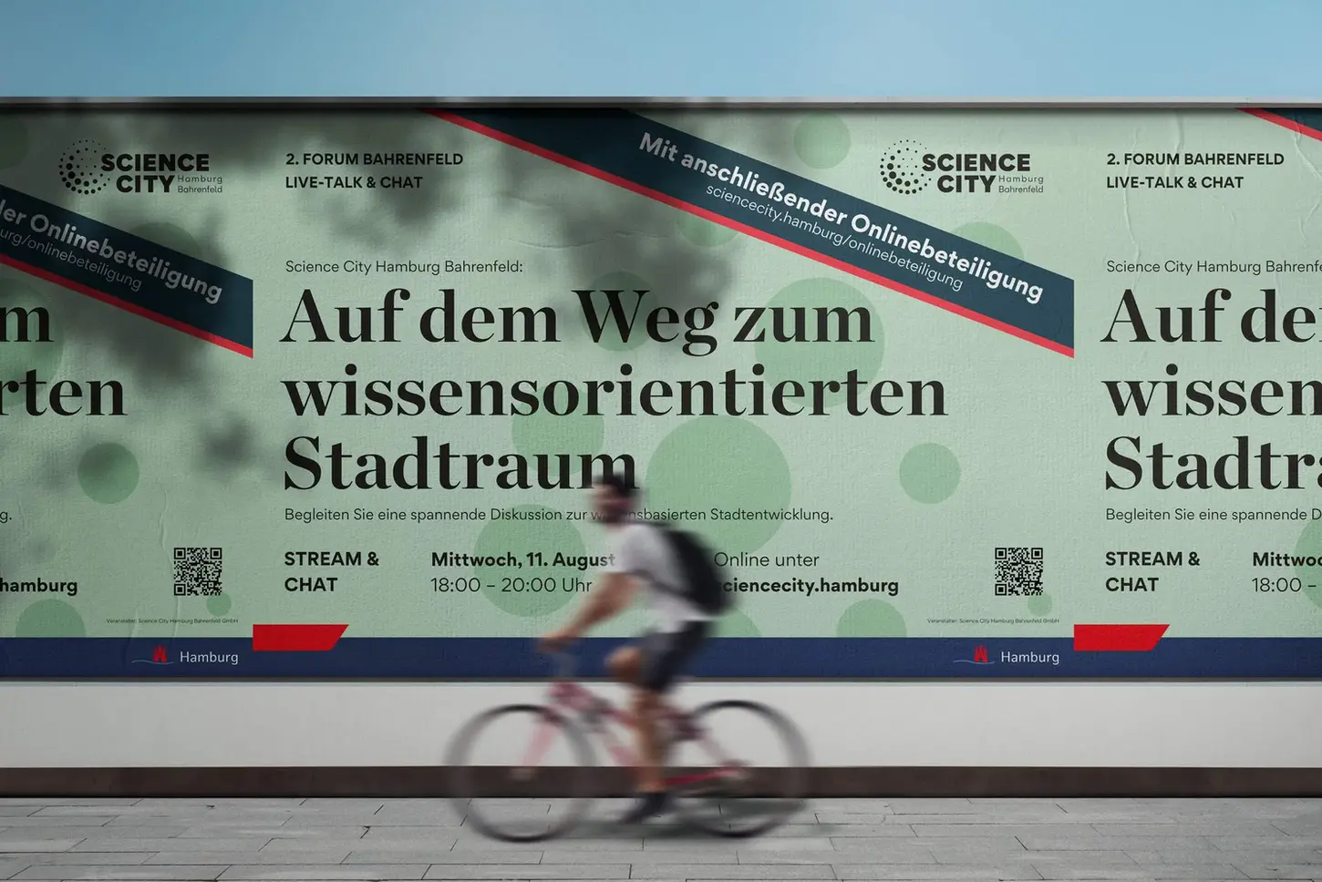 A large mint green horizontal banner for Science City Hamburg, titled "On the way to a knowledge-oriented urban space," with a blurred cyclist passing by.