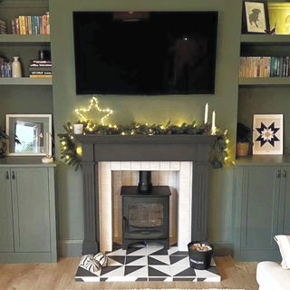 green colour drenched wall matching alcove units