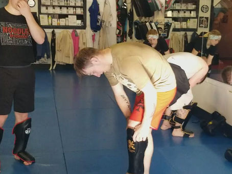 Coach Chance demonstrates The Violence of Action in a drill with Mark.