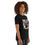Thumbnail: Woman wearing black t-shirt with MLK Jr. portrait, smiling confidently side view
