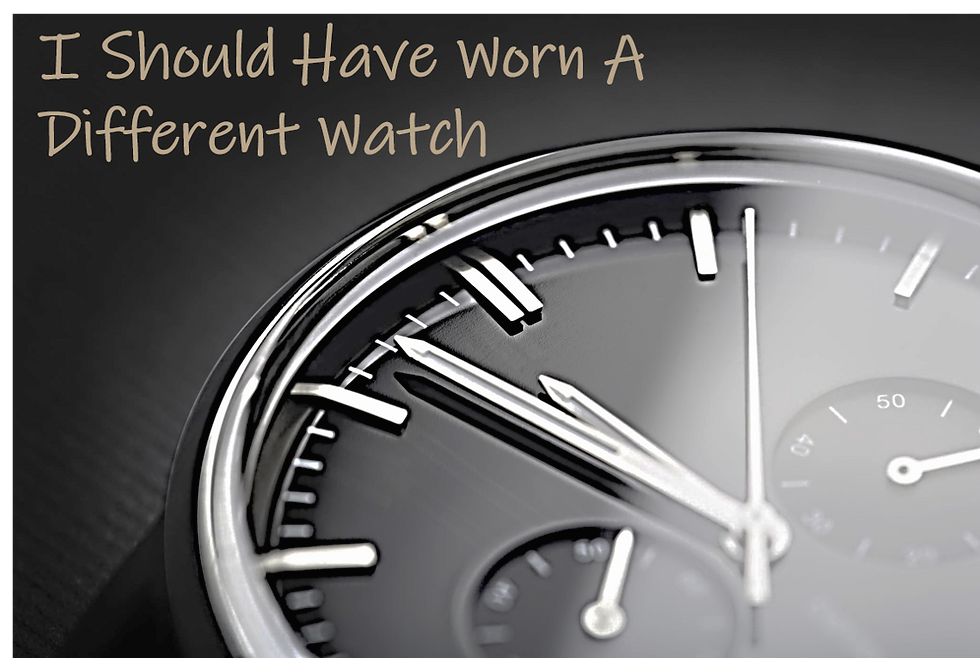 Cover Image. An analog watch face with the words "I Should Have Worn A Different Watch" over the top of it